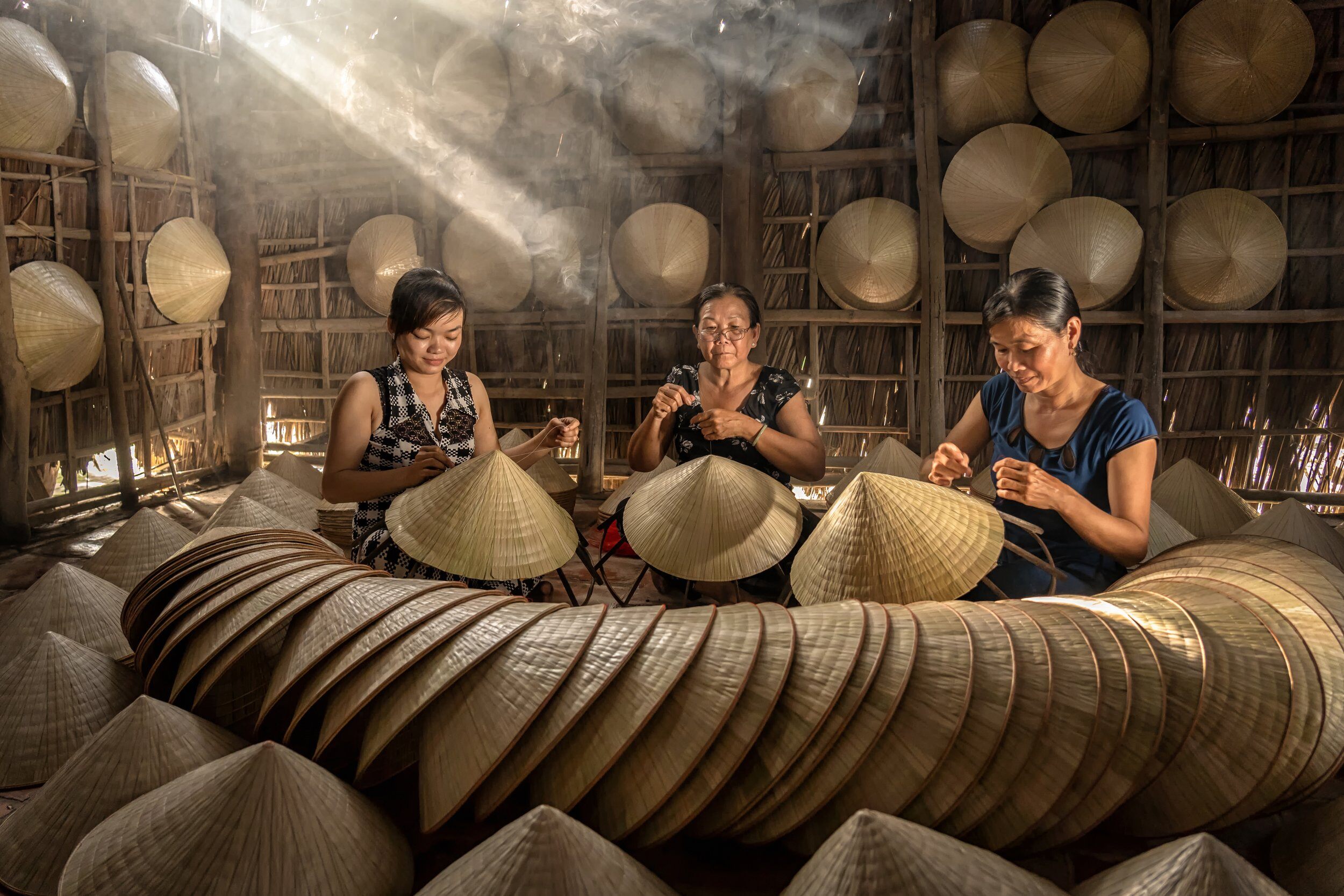 group-of-vietnamese-female-craftsman-making-the-tr-2022-12-16-03-25-24-utc